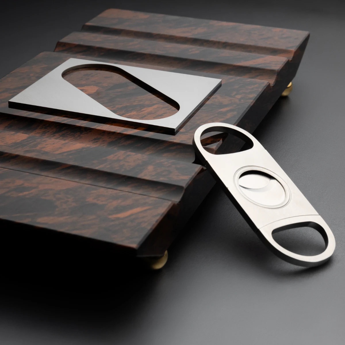 Board No. II — gold legs detail, obsidian board top view