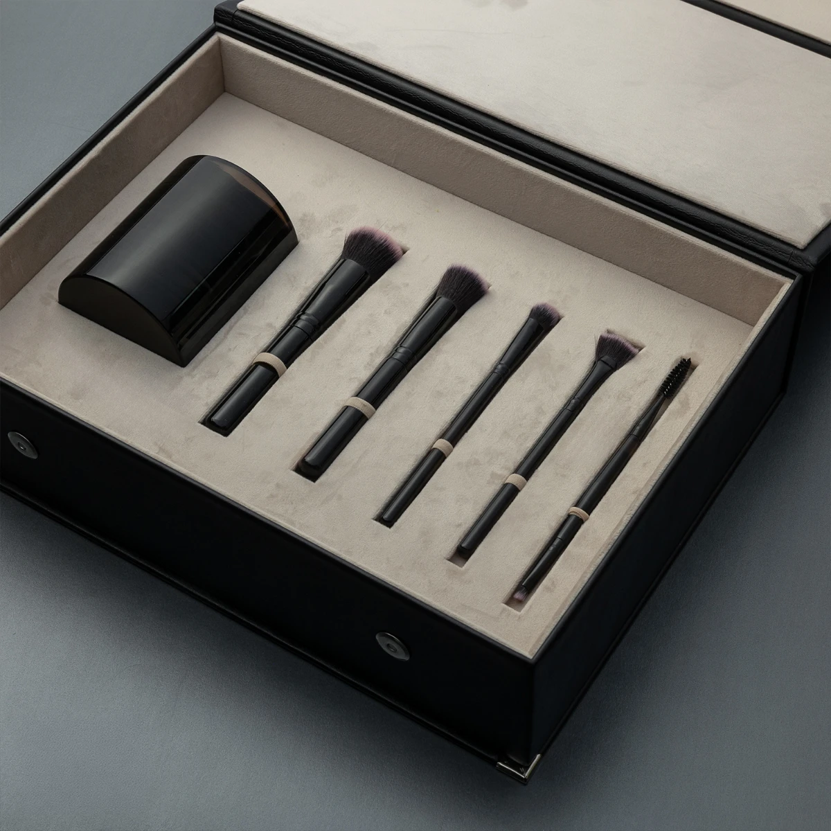 Obsidian make-up brushes set — luxury volcanic stone accessory