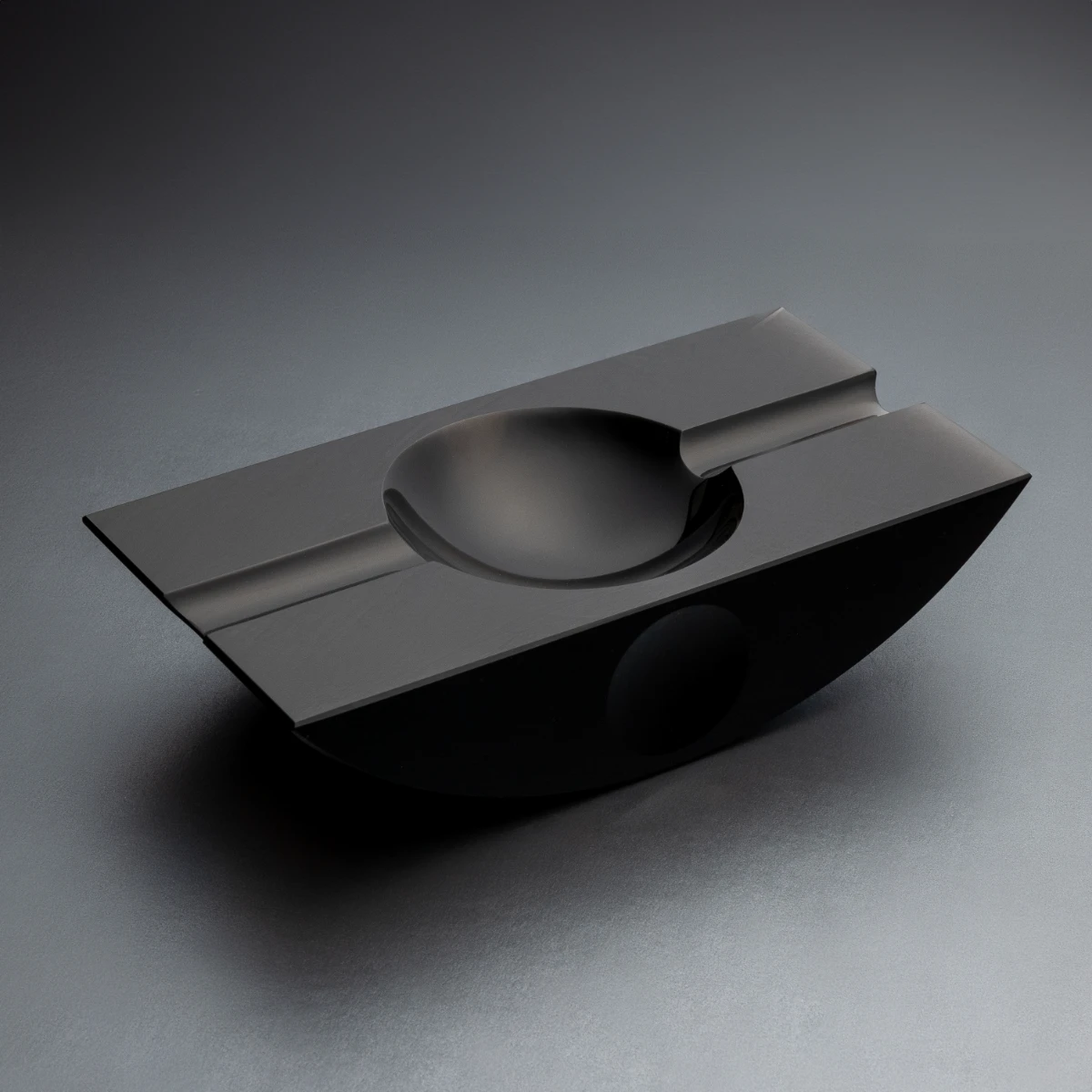 Swing Jet Black obsidian cigar ashtray — curved sides, vessel form